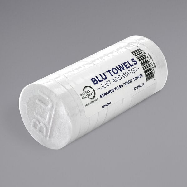 A roll of white Mercer Culinary BLU&#8482; compressed foodservice towels.