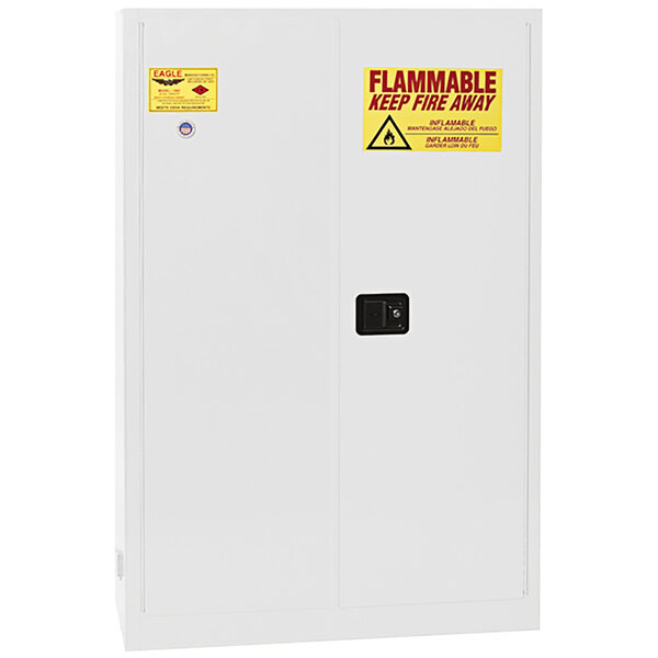 A white Eagle Manufacturing flammable liquid safety cabinet with yellow and red warning signs.