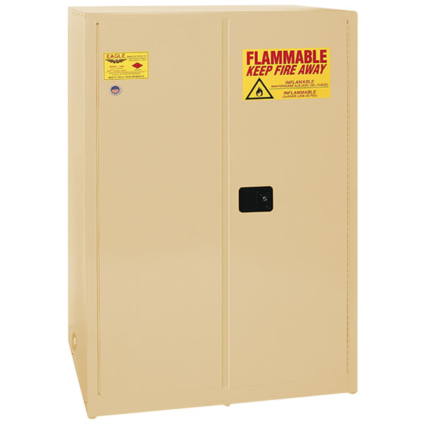 A tan Eagle Manufacturing safety cabinet with a yellow flammable label.