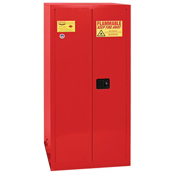 A red metal Eagle safety cabinet with a yellow and red label.