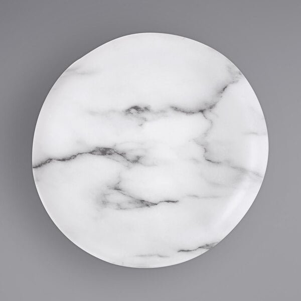 A white Bon Chef melamine dinner plate with black marbled veins.