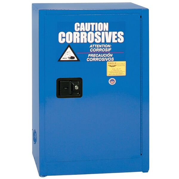 A blue Eagle Manufacturing safety cabinet for acid and corrosives with white text on the door.