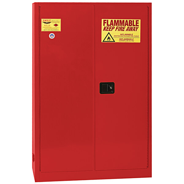 A red Eagle Manufacturing safety cabinet with a yellow and red warning sign.