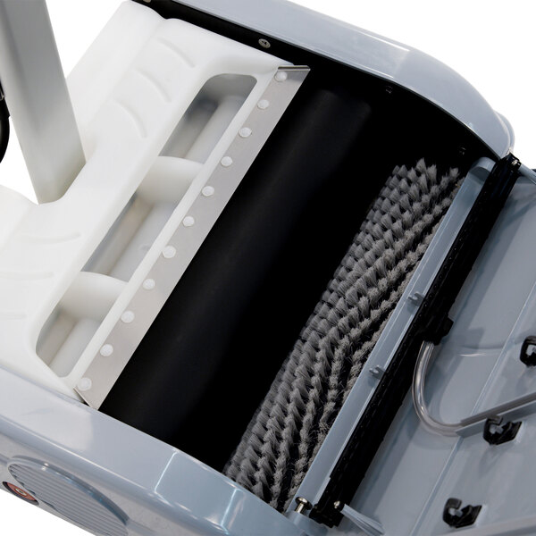 A Namco Floorwash 5000 walk behind cylindrical floor scrubber with a handle.