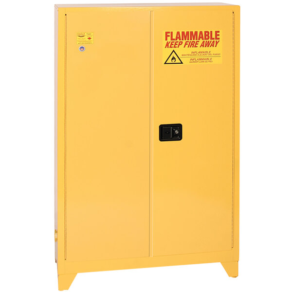 A yellow Eagle Manufacturing safety cabinet with 2 self-closing doors and a black handle.