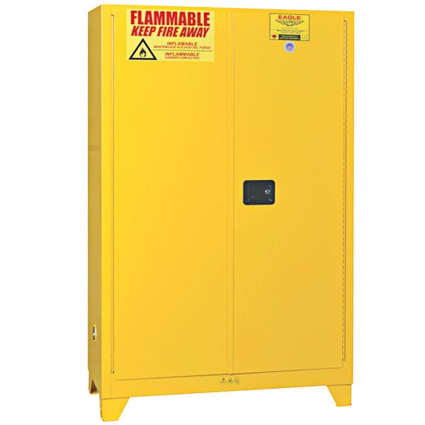 A yellow Eagle safety cabinet with a sign on it.