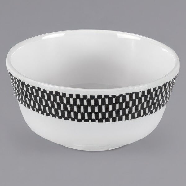 A white melamine bowl with a black and white checkered rim.