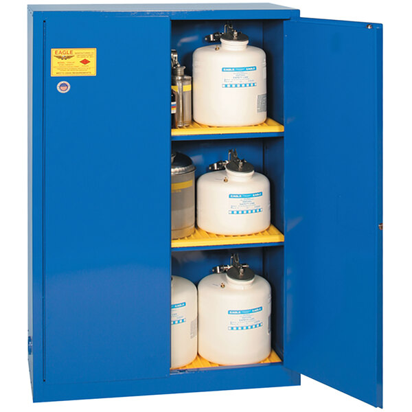 A blue Eagle Manufacturing safety cabinet with white containers inside.