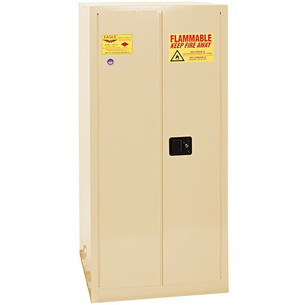 A white metal Eagle safety cabinet with a yellow label and manual-closing door.