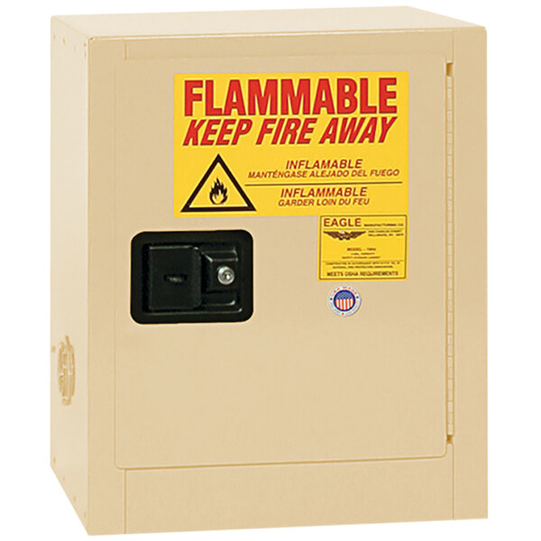 A white Eagle Manufacturing safety cabinet with a yellow flammable liquid sign on it.