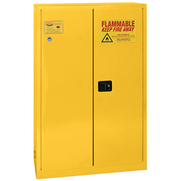 A yellow Eagle Manufacturing safety cabinet with 2 self-closing doors and a red warning sign.