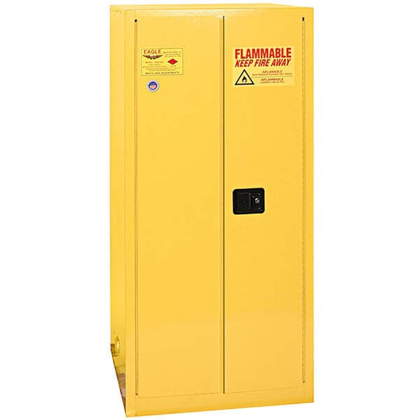 A yellow metal Eagle Manufacturing safety cabinet with a manual-closing door.