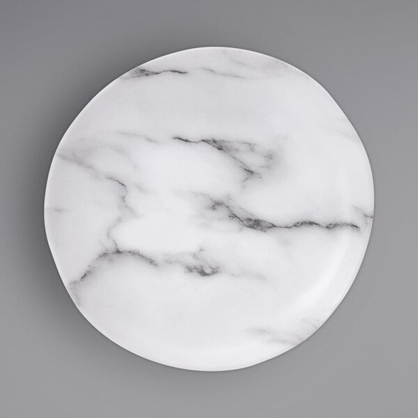 A white Bon Chef melamine salad plate with black marbling.