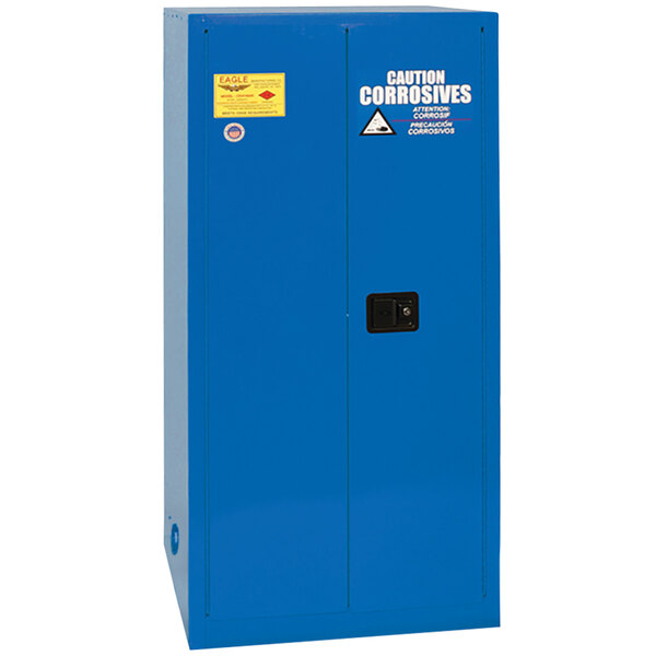 A blue metal safety cabinet with 2 doors and a yellow label.