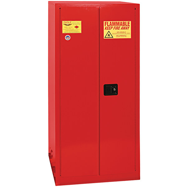 A red metal Eagle safety cabinet with a yellow and red warning label.