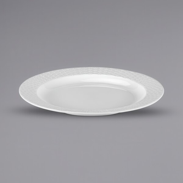 A white Bon Chef melamine plate with a patterned rim.