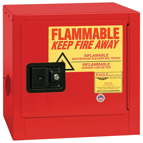 A red Eagle Manufacturing safety cabinet with yellow and red flammable warning sign.