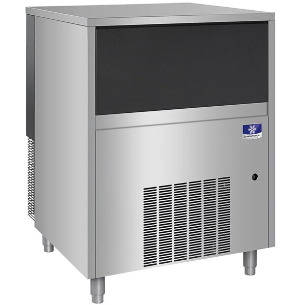 A large silver Manitowoc undercounter ice machine with a black window.