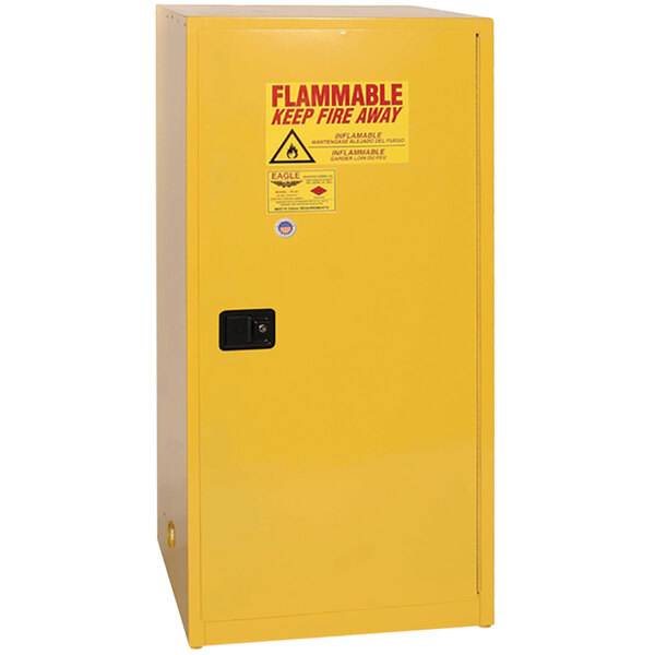 A yellow metal Eagle Manufacturing flammable liquid safety cabinet with a self-closing door and 3 shelves.