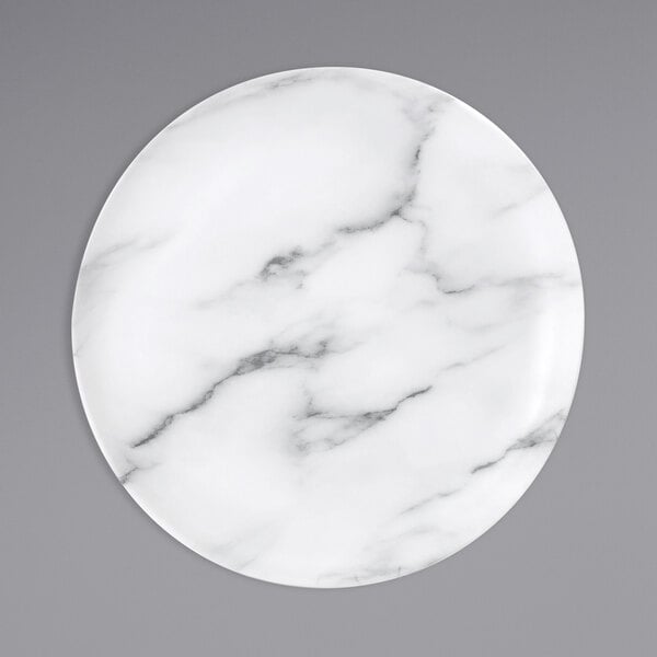 A white Bon Chef melamine dinner plate with a marble pattern and black veins.