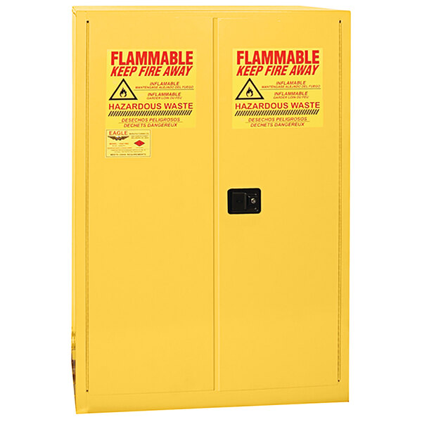 A yellow Eagle Manufacturing HazMat safety cabinet with two doors and a keyhole.