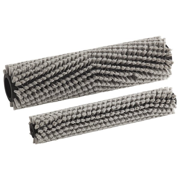 A close-up of two grey Namco floor scrubber brushes.
