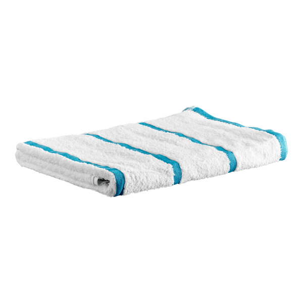 A folded white towel with blue stripes lying on a white background.