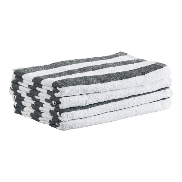 A stack of four folded towels with gray and white horizontal stripes.