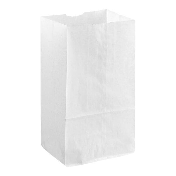 A plain white waxed paper bag standing upright.