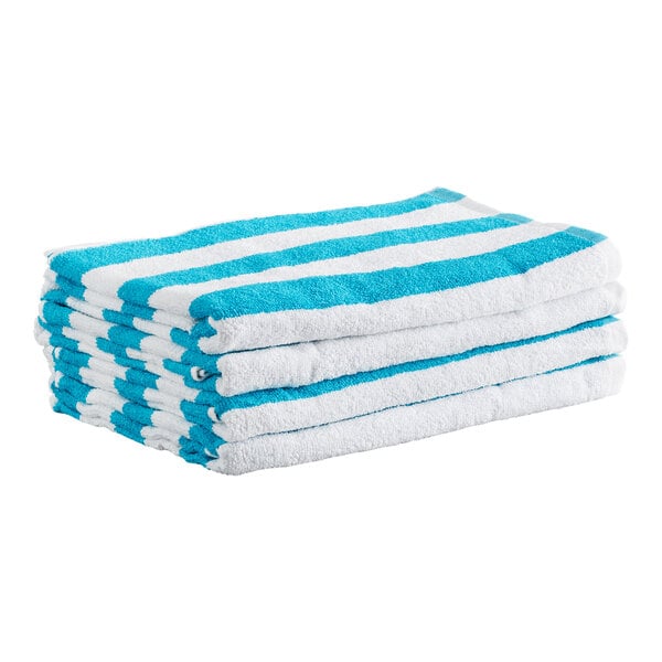 A stack of four folded towels with blue and white horizontal stripes.