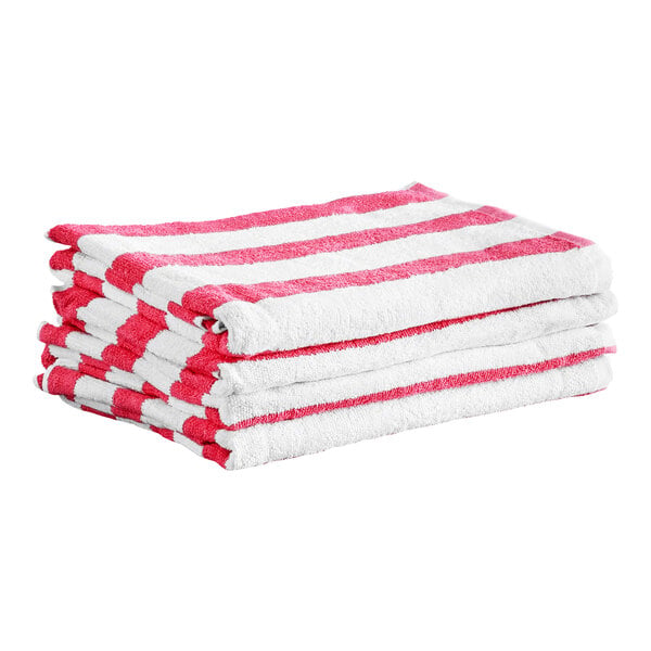 A stack of four white towels with pink horizontal stripes.