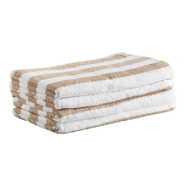 A stack of four beige and white striped towels.