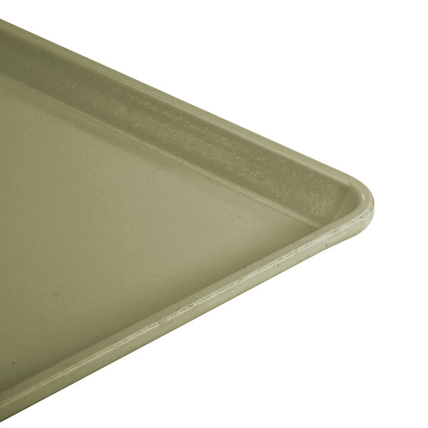 A close-up of an olive green Cambro dietary tray.