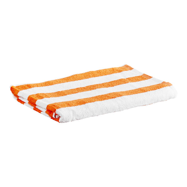 A folded towel with orange and white horizontal stripes.