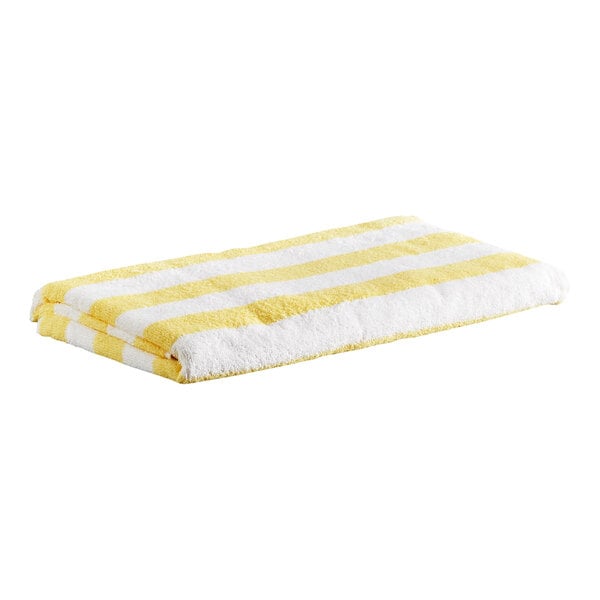 A folded towel with yellow and white horizontal stripes.