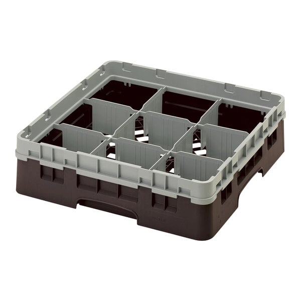 A brown Cambro plastic container with 9 compartments and 1 extender with 9 compartments.