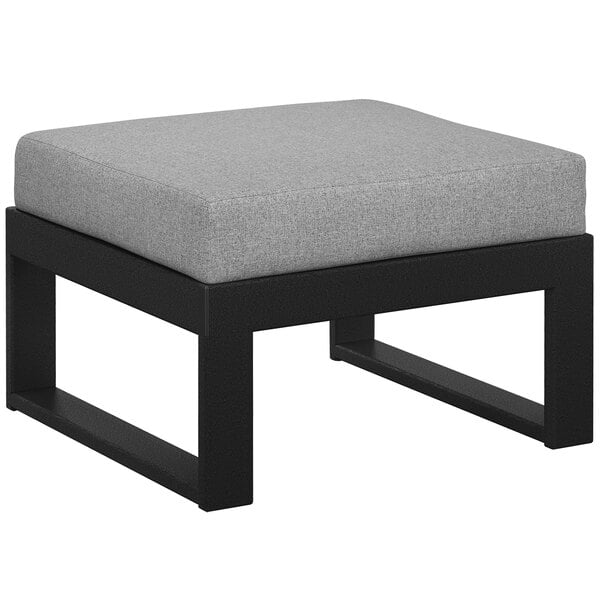 A grey and black POLYWOOD ottoman with a grey cushion.