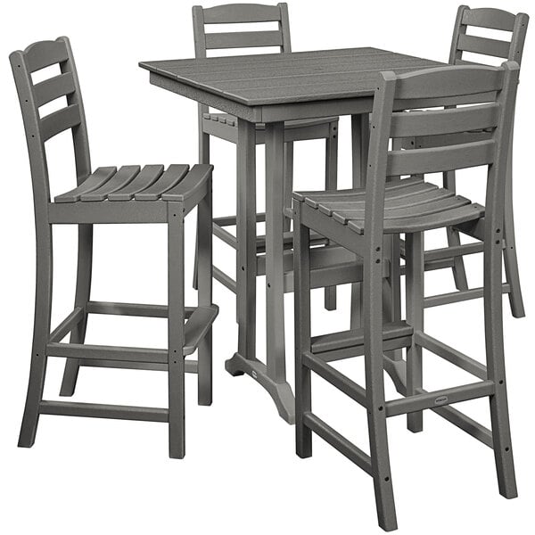 A POLYWOOD grey outdoor table with four chairs on an outdoor patio.