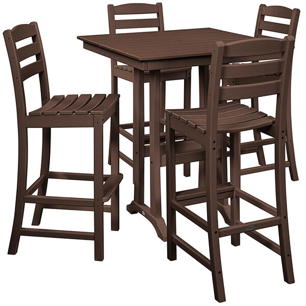 A POLYWOOD mahogany table and chairs on a patio.