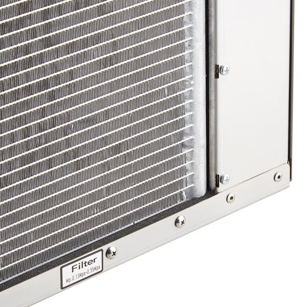 A close up of a metal grid on an Avantco air cooled ice machine.