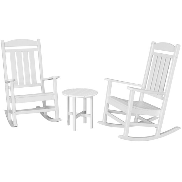 A white POLYWOOD rocking chair with a round side table.