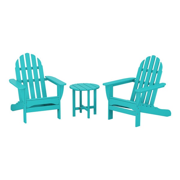 A group of blue POLYWOOD Adirondack chairs and a round table.