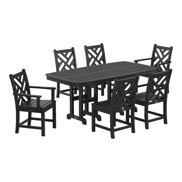 A POLYWOOD black dining set with six Chippendale chairs and a Nautical table on an outdoor patio.