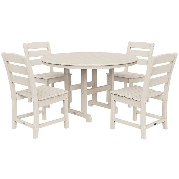 A POLYWOOD sand round table with four chairs.