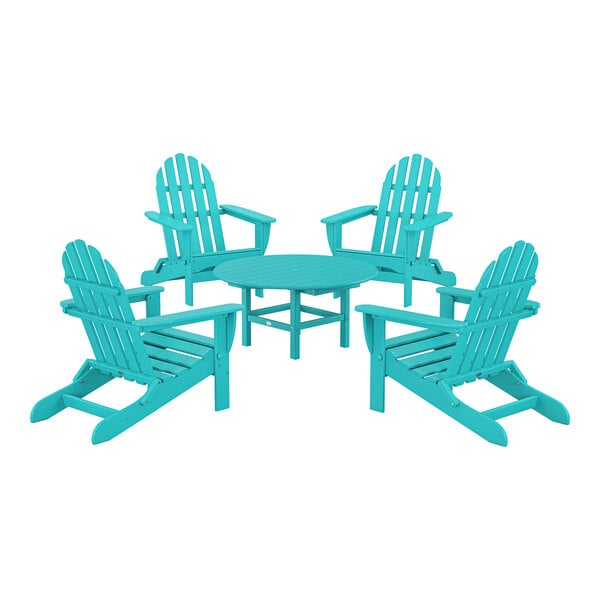 A POLYWOOD Aruba patio table and blue Adirondack chairs.