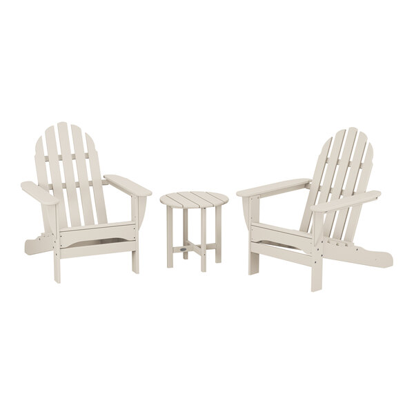 A group of three white POLYWOOD Adirondack chairs and a round table.