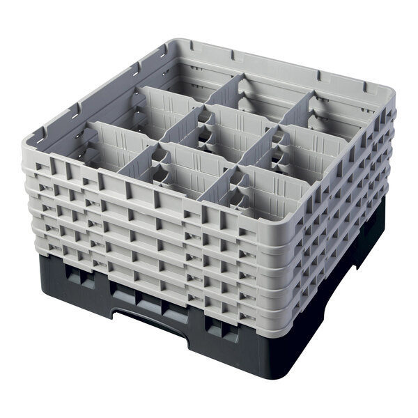A black plastic Cambro glass rack with 9 compartments and 5 extenders.