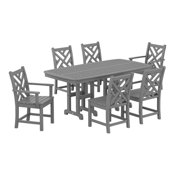 A POLYWOOD slate grey dining table and chairs set on an outdoor patio.