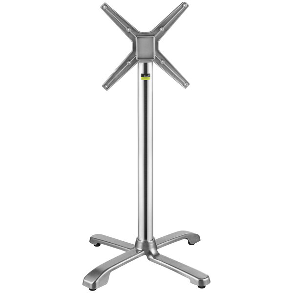 A close-up of a silver FLAT Tech bar height table base with a metal cross on top.