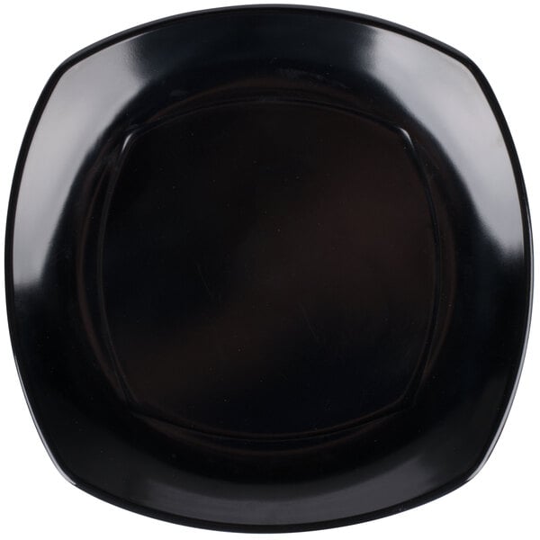 A black square plate with upturned corners.